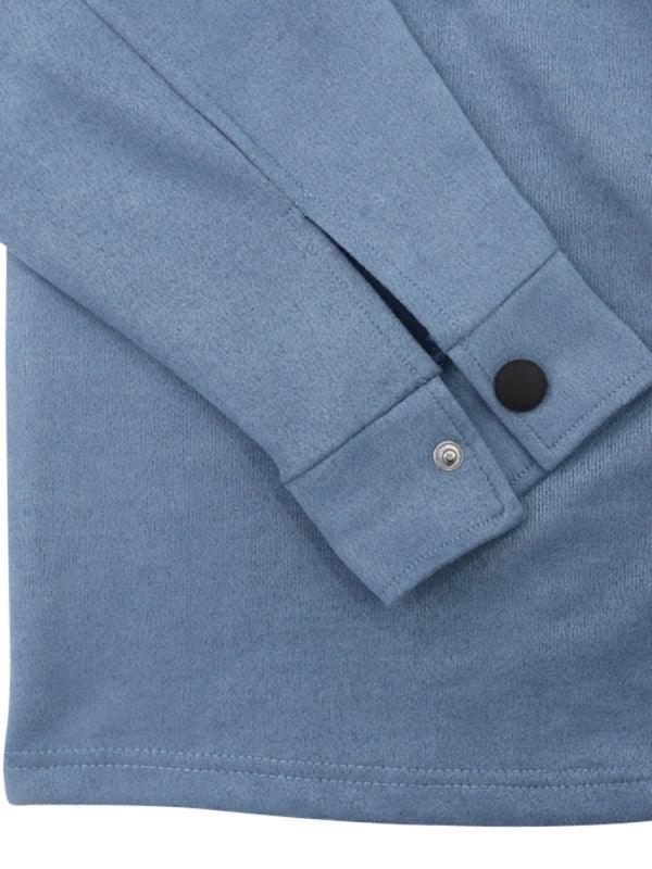 Close-up view of long sleeved vintage trousers in blue fabric with button detail