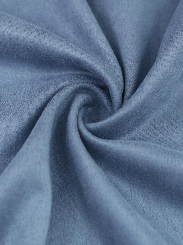 Soft fabric close-up showcasing blue long sleeved vintage trousers for a stylish look