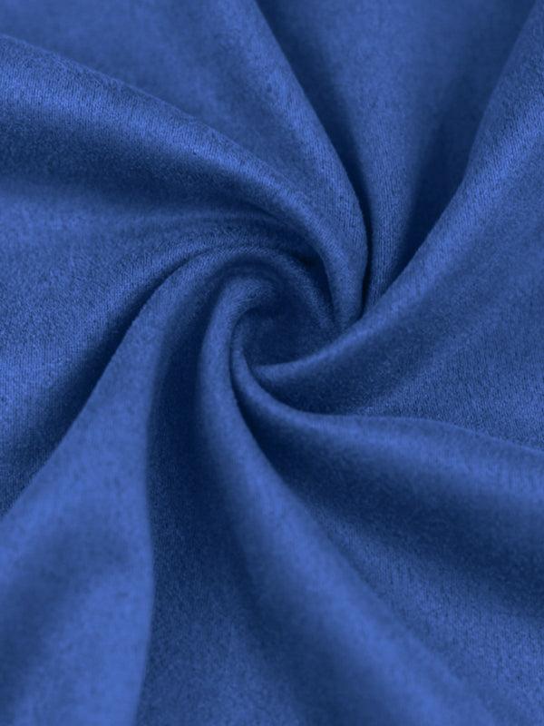 Soft blue fabric showcasing long sleeved vintage trousers material with a smooth texture
