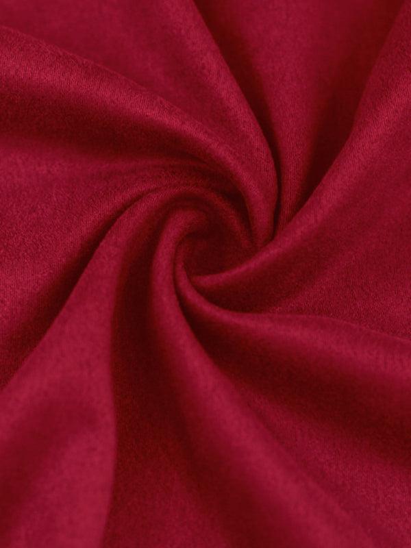 Textured red fabric showcasing long sleeved vintage trousers for stylish outfits