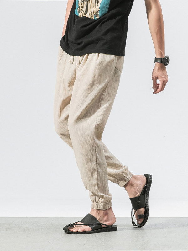 Kakaclo men's linen drawstring pants in beige with elastic cuffs for comfort and style