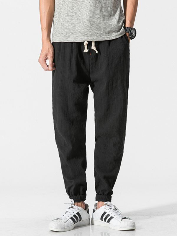 Kakaclo men's linen drawstring pants in black with elastic cuffs and side pockets
