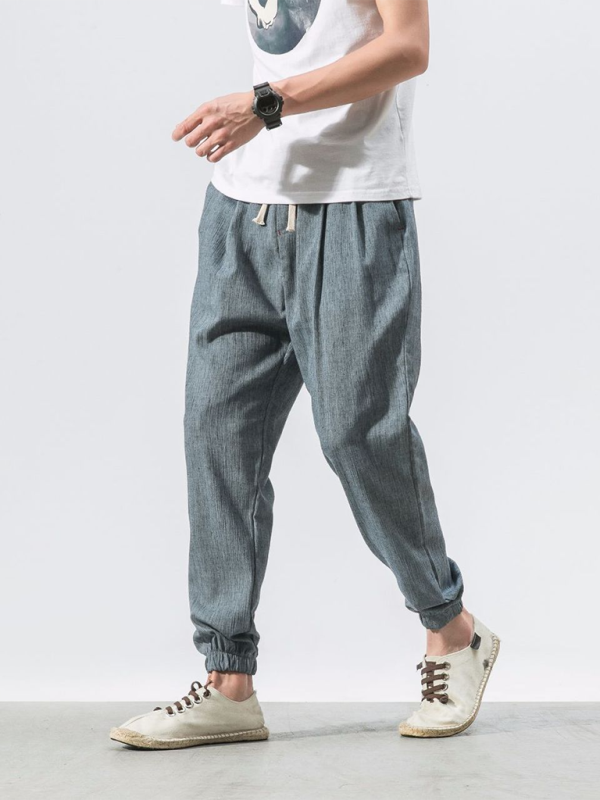 Men's linen drawstring pants in gray with a casual fit and elastic cuffs for summer comfort