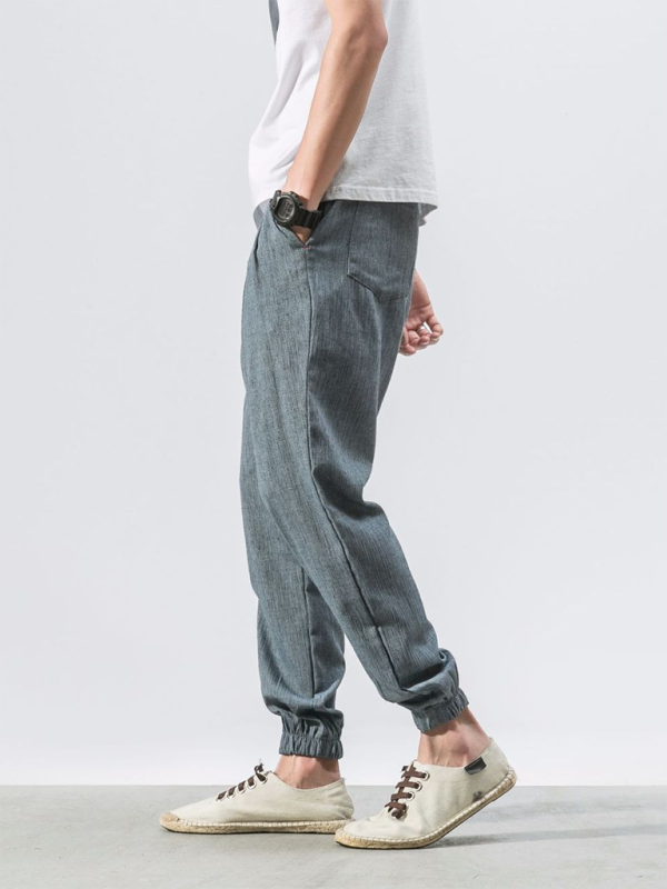 Men's linen drawstring pants in gray with a comfortable elastic waistband and side pockets