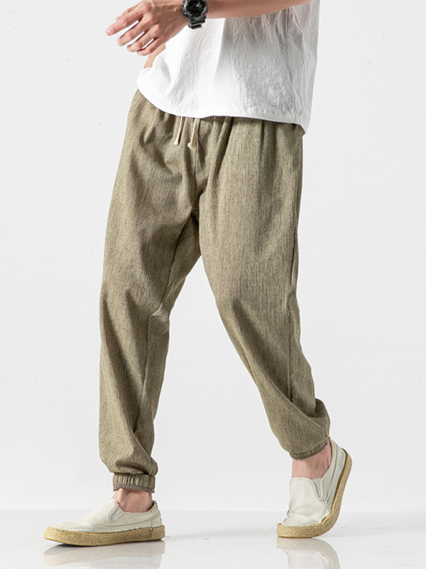 Men's linen drawstring pants in olive green with comfortable fit and elastic cuffs