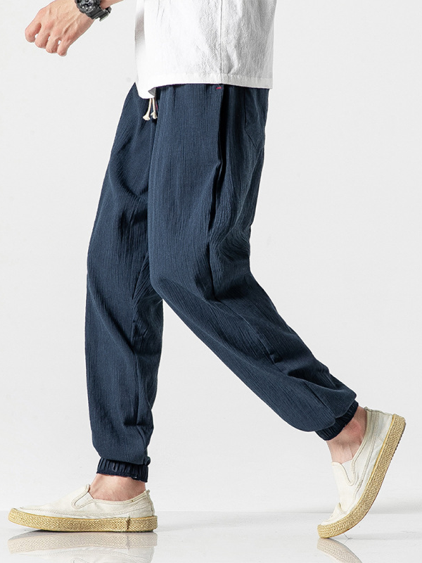 Kakaclo men's linen drawstring pants in navy blue designed for comfort and casual style