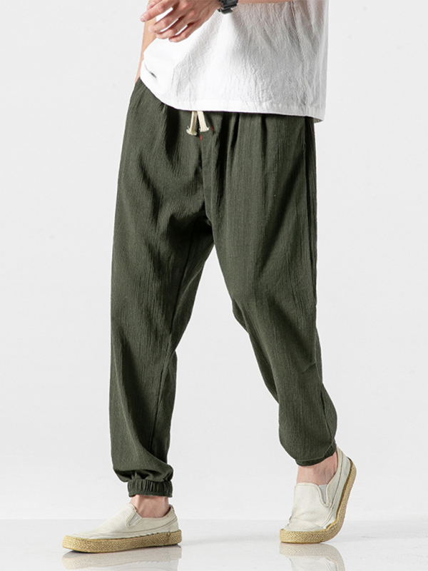 Men's linen drawstring pants in dark green with comfortable elastic cuffs and stylish design