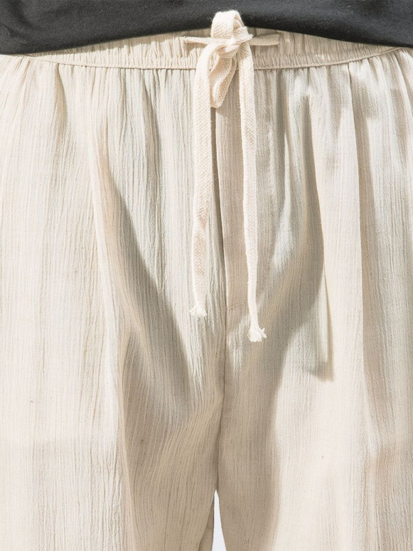 Kakaclo men's linen drawstring pants in cream with a comfortable elastic waistband