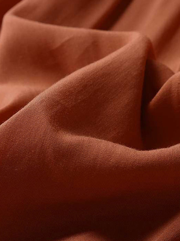Close-up of soft fabric texture in rust color for vintage swing dress by Kakaclo