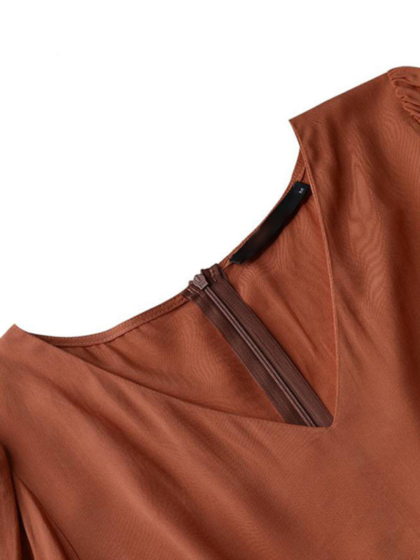 Close-up of Kakaclo vintage swing dress showing the elegant V-neck and zipper detail