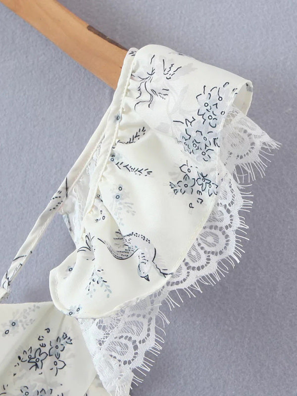 Close-up of kakaclo French style lace camisole with ruffled detailing and floral design