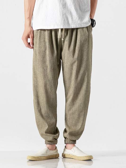 Kakaclo men's linen drawstring pants in light brown with elastic cuffs and comfortable fit