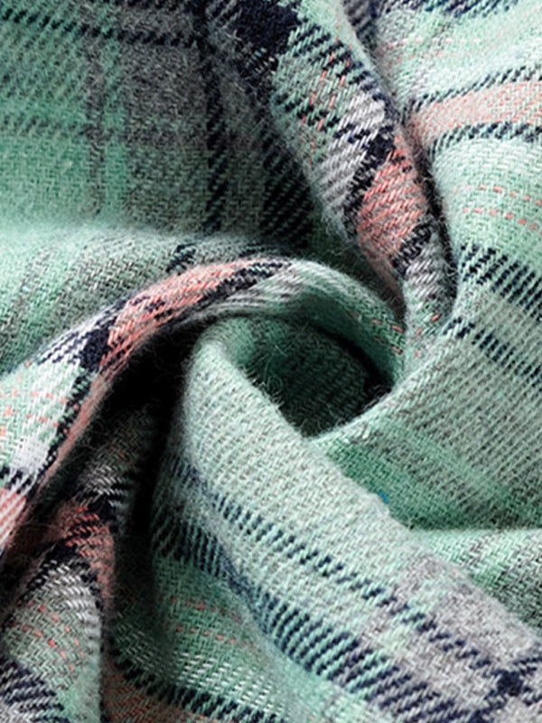 Close-up of a soft fabric showcasing a retro style hoodie shirt in green plaid pattern